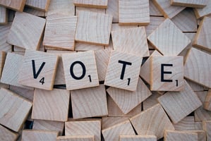 Letter blocks spelling the word "vote".